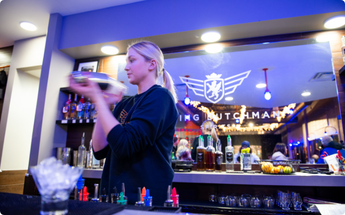 A bartender mixing a cocktail